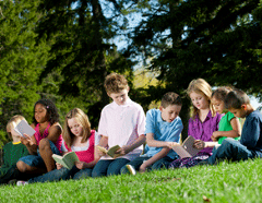 kids-on-hill-reading-small-292x227